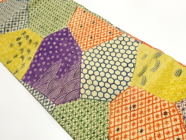 手織り紬切り嵌め風型染古典柄に波模様名古屋帯